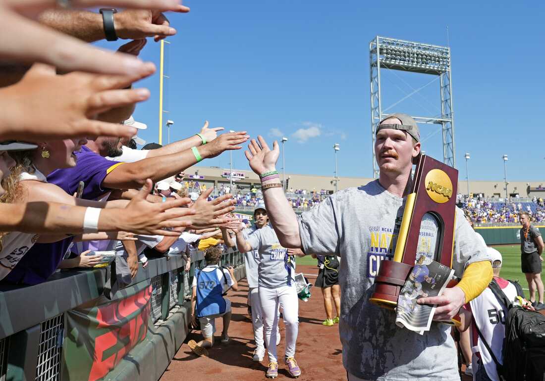 Jared Jones of the LSU Tigers celebrates with fans after defeating the Coastal Carolina Chanticleers to win the NCAA College World Series baseball finals last month in Omaha, Neb.