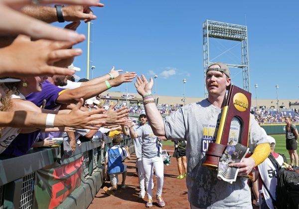 Jared Jones of the LSU Tigers celebrates with fans after defeating the Coastal Carolina Chanticleers to win the NCAA College World Series baseball finals last month in Omaha, Neb.