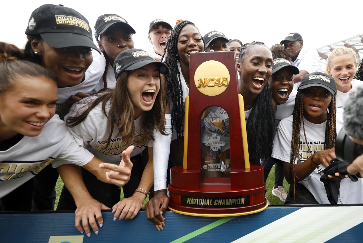 University of Florida athletes celebrate the women's team title during the NCAA Division 1 Outdoor Track & Field Championships on June 11, 2022. Under a proposed legal settlement, many athletes on track and field, swimming and other collegiate sports could see their roster spots eliminated.
