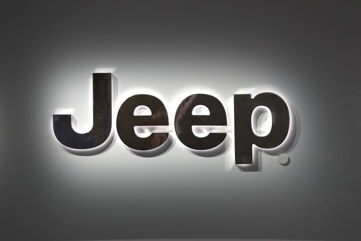 A Jeep logo is displayed at the North American International Auto Show in Detroit on Jan. 14, 2019. Jeep is recalling more than 194,000 plug-in hybrid SUVs worldwide because they can catch fire with the ignition turned off.