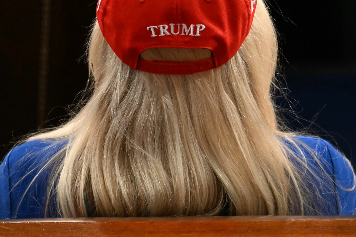 Representative Marjorie Taylor-Greene (R-GA) listens as US President Donald Trump speaks during an address to a joint session of Congress.
