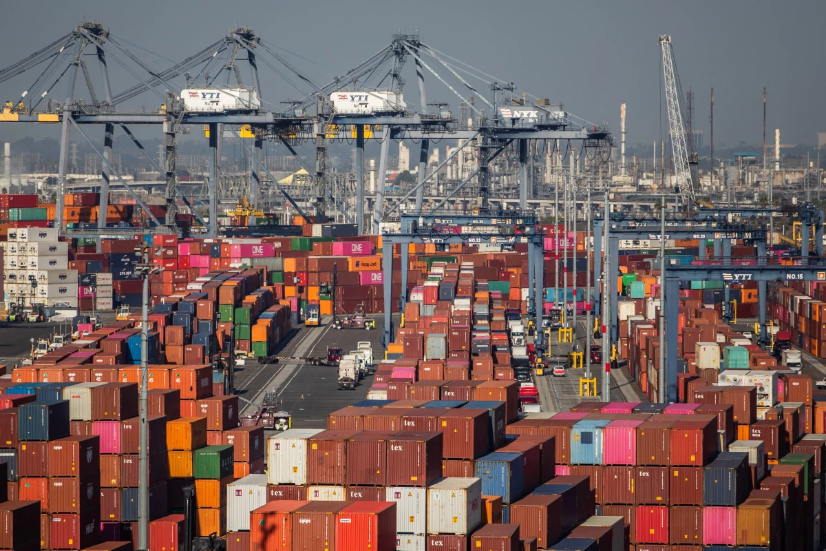 Gantry cranes, shipping containers and trucks are seen inside the Port of Los Angeles in San Pedro, California