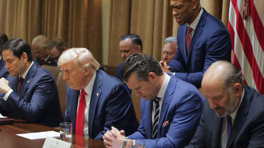 Housing and Urban Development Secretary Scott Turner prays during a Cabinet meeting with President Donald Trump at the White House in Washington on Feb. 26, 2025, as Secretary of State Marco Rubio and Defense Secretary Pete Hegseth and Commerce Secretary Howard Lutnick also bow their heads.