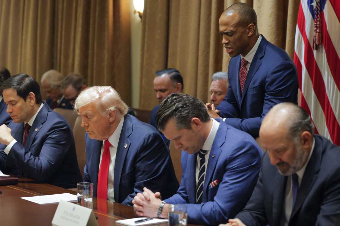 Housing and Urban Development Secretary Scott Turner prays during a Cabinet meeting with President Donald Trump at the White House in Washington on Feb. 26, 2025, as Secretary of State Marco Rubio and Defense Secretary Pete Hegseth and Commerce Secretary Howard Lutnick also bow their heads.