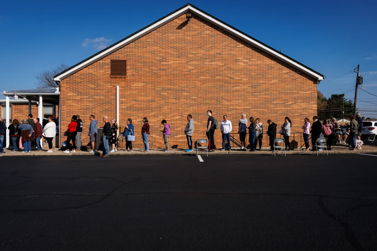 People wait in line to vote outside a polling station at the Dryland United Church of Christ in Nazareth, Pa., on Tuesday.