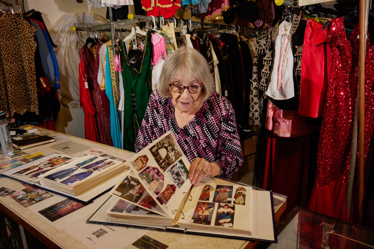 Boschet flips through a lookbook full of her custom designs.