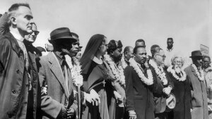 Civil rights demonstrators, led by Dr Martin Luther King (5th R), civil rights activist Ralph Abernathy (5th L), John Lewis (3rd L) and other civil and religious leaders, make their way from Selma to Montgomery on March 22, 1965 in Alabama.