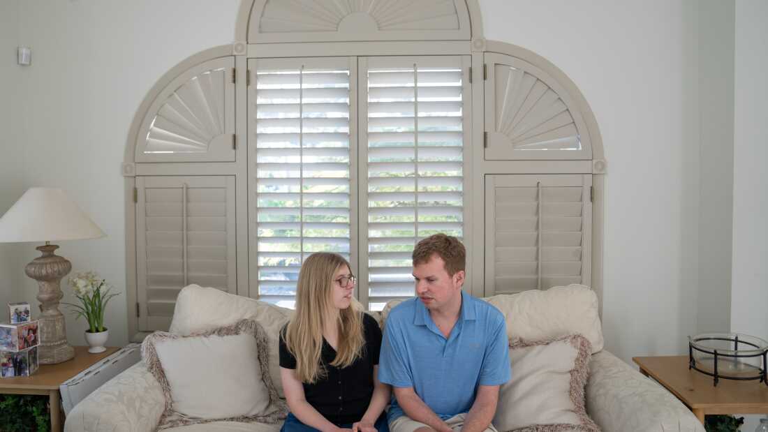 Cody and Kaleigh Brendle sit together at their home.