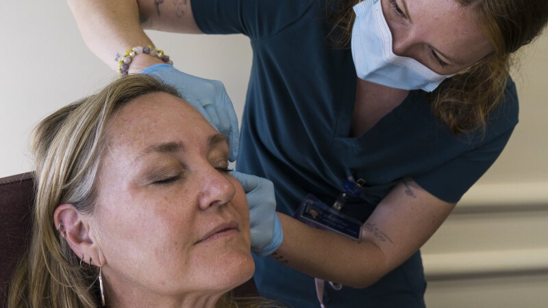 Image 31: Samantha Pohlman, a registered nurse, performs a cosmetic treatment procedure on Christine Ruiz at Planned Parenthood - B Street, in Sacramento, Calif., Friday, March 20, 2026. Planned Parenthood is expanding its services by offering cosmetic treatments like injections and weight loss drugs like GLP-1’s to expand its revenue sources. 