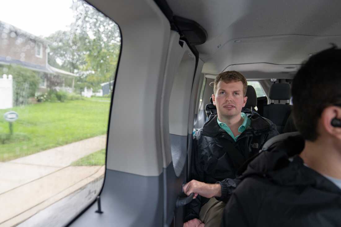 Cody Brendle rides in a van on a group outing to the grocery store with Next Steps.
