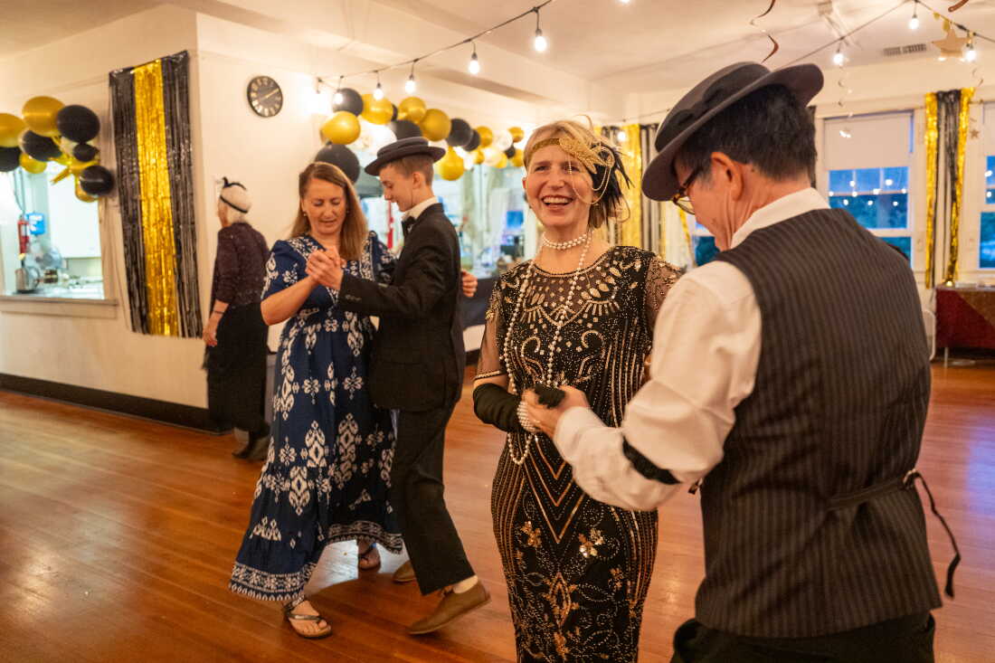 Buster Keaton Conference attendees Joy Blatchford (from left) dances with her son Aden Blatchford and Katrina Nguyen dances with her husband Khoi Nguyen at a 1920s themed dance in Cottage Grove, Ore. Aden, Katrina and Khoi are dressed in 1920s clothes.