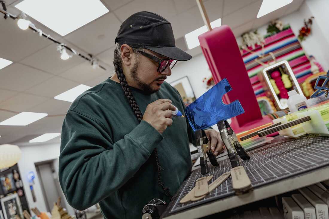 Victor "Marka27" Quiñonez's crafts the resin portion of the paleta scultpures from his "I.C.E. Scream" Series.