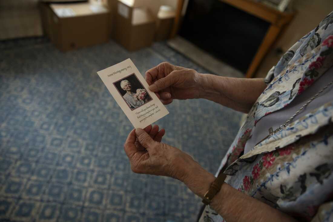 Sister Claire Pratt, 86, holds a photo of Anne Montgomery who the house was named after in Washington, D.C. on July 31, 2026. The community house that is closing after a decade was run by Society of the Sacred Heart, an international congregation of Roman Catholic religious women.