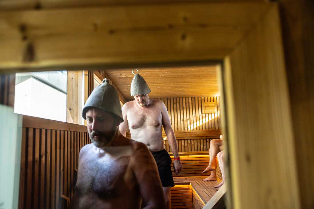 JJ Meston, right, and Chris Shotwell, both from Seattle, exit a sauna after a session during the Seattle Sauna Festival. Heat can boost the cardiovascular system in similar ways to exercise, research finds.