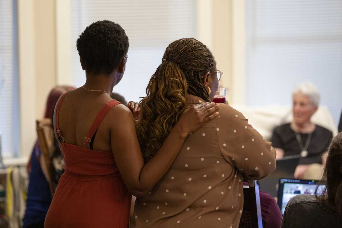 Funmilayo Erinfolami, left, listens to the virtual gathering of former residents and friends of Anne Montgomery House at the farewell celebration in Washington, D.C. on July 31, 2026. The community house that is closing after a decade was run by Society of the Sacred Heart, an international congregation of Roman Catholic religious women.