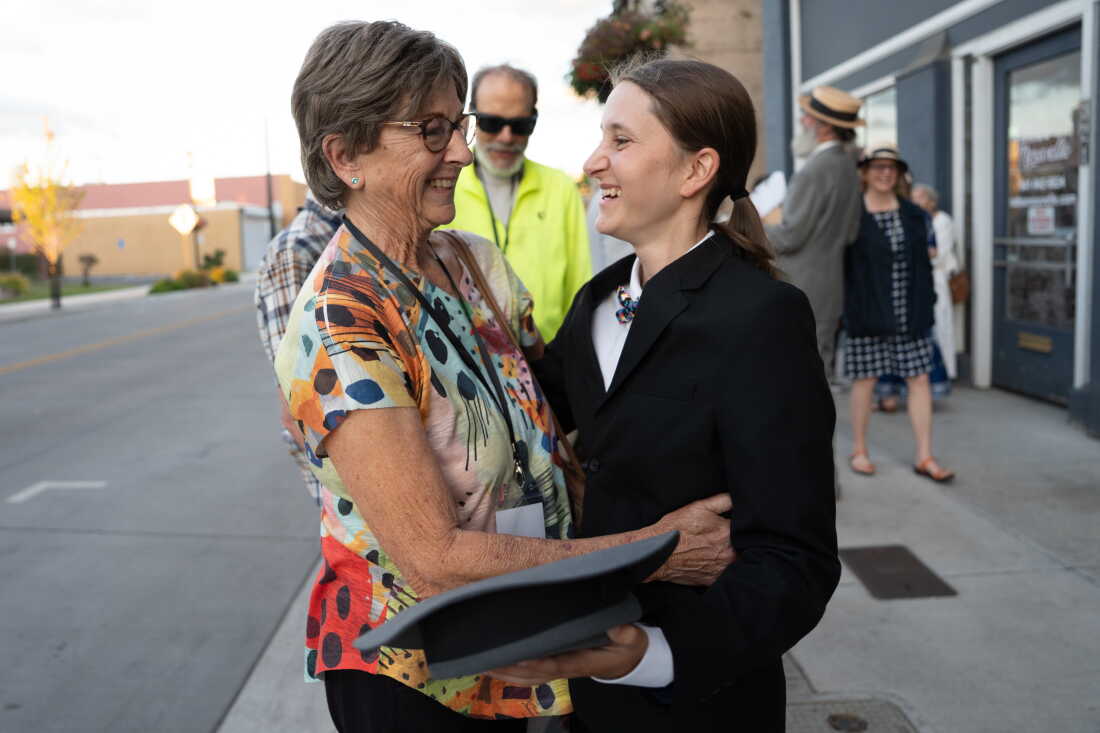 Melissa Talmadge-Cox (left), Keaton's granddaughter, hugs Chloe Fadem.