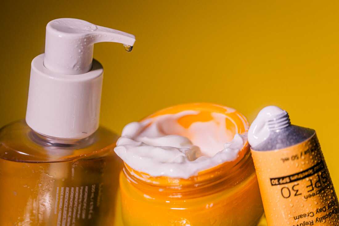 A bottle of cleanser, a jar of moisturizer and a tube of sunscreen.