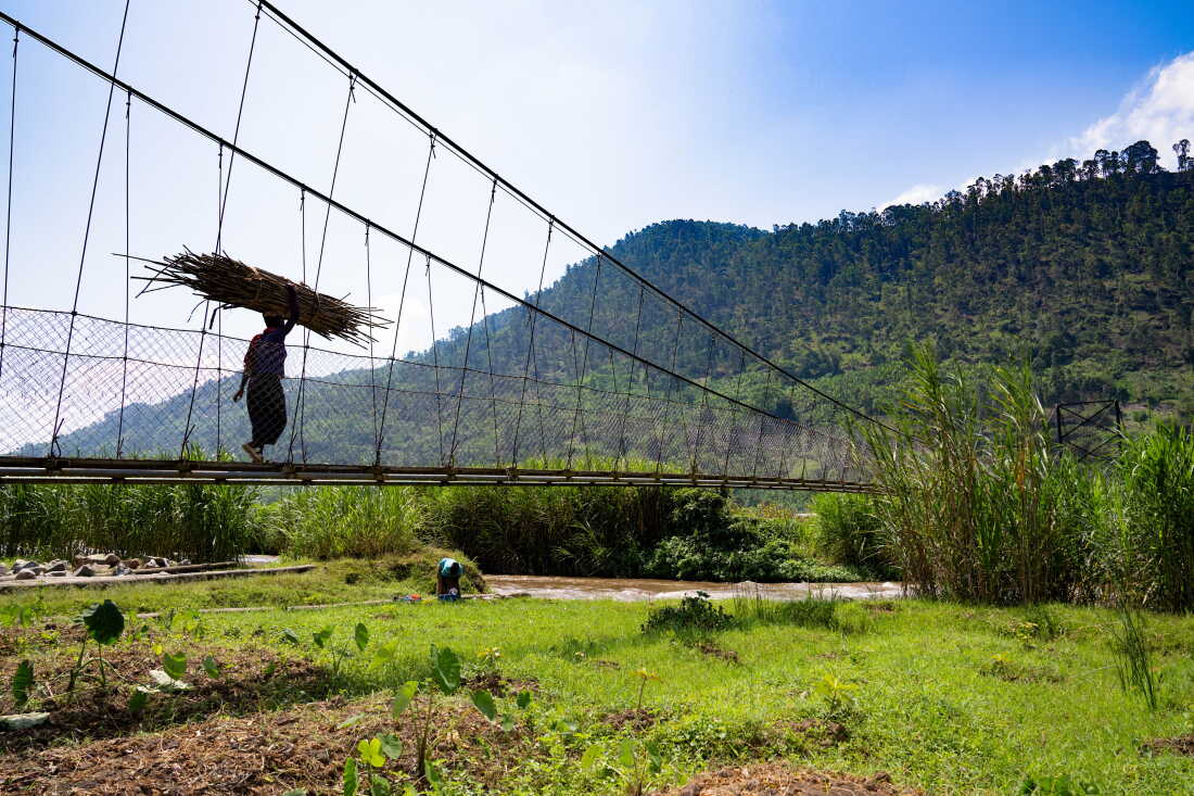The communities on either side of the river share services like a community health post and a school, and the bridge also allows people to bring goods back and forth to a local market to trade more easily.