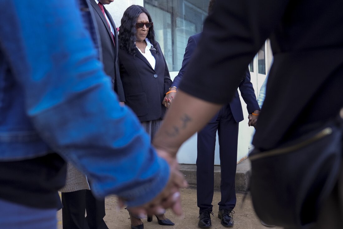 RowVaughn Wells, left, mother of Tyre Nichols, prays with family and friends before entering the federal courthouse Wednesday during the trial of three former Memphis police officers charged in the 2023 fatal beating of her son in Memphis, Tenn. (AP Photo/George Walker IV)