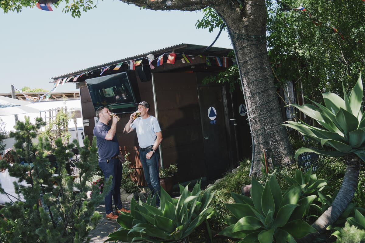 Headlands Brewing brewmaster Ryan Frank and CEO Austin Sharp share a Common Ground beer in Berkeley, Calif., ahead of the first World Cup game on June 11.
