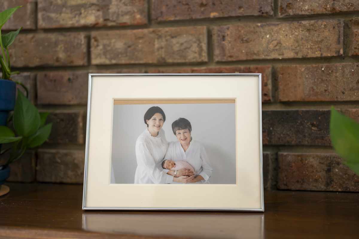 A framed photo of Laura Terry with her mother, Jo, holding baby Eleanor.