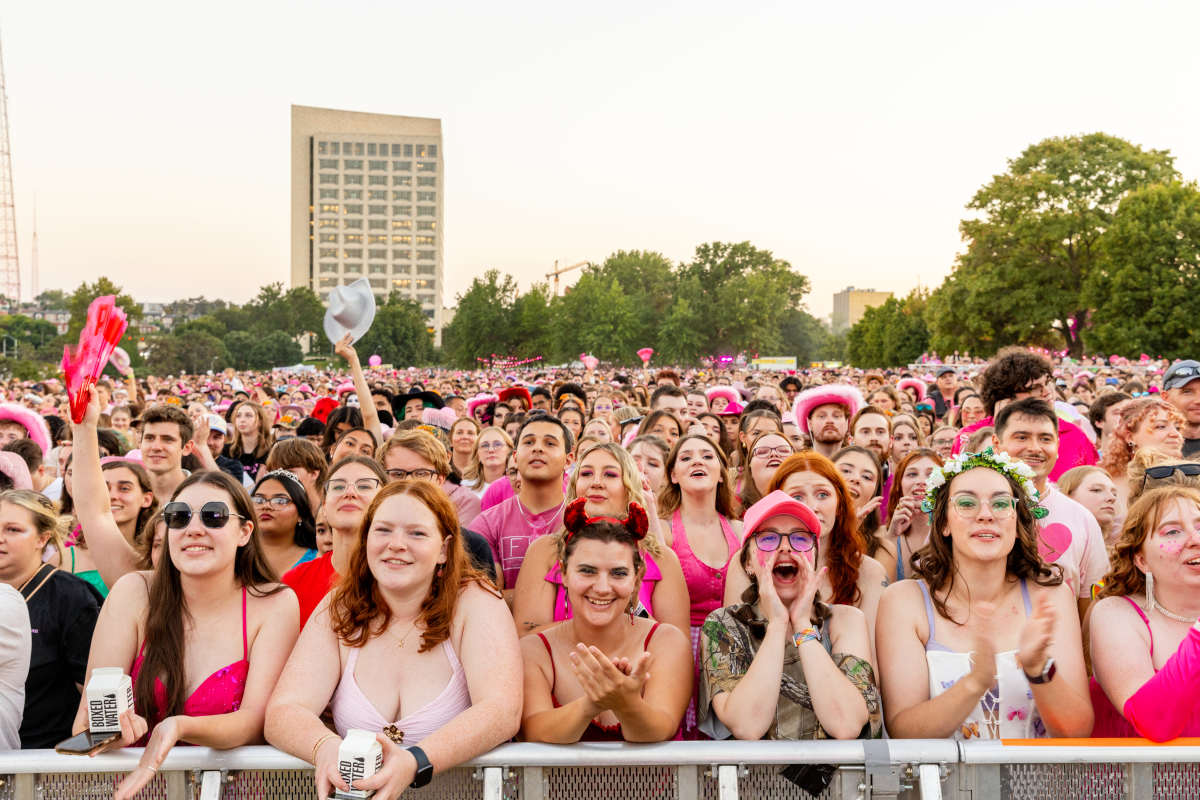 Concertgoers watch local drag performers open for Chappell Roan on Friday at the National WWI Museum and Memorial in Kansas City.