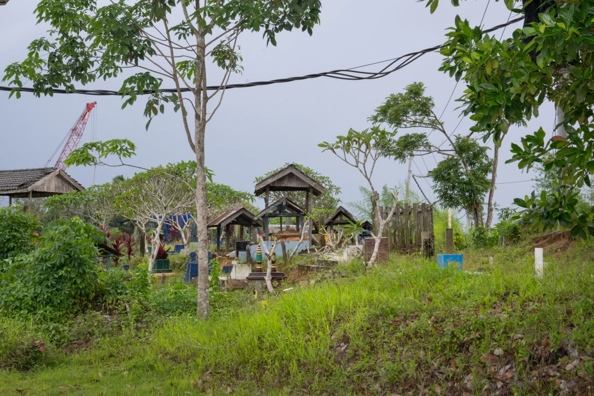 The village's cemetery sits on the same land as the new dam and water treatment plant.
