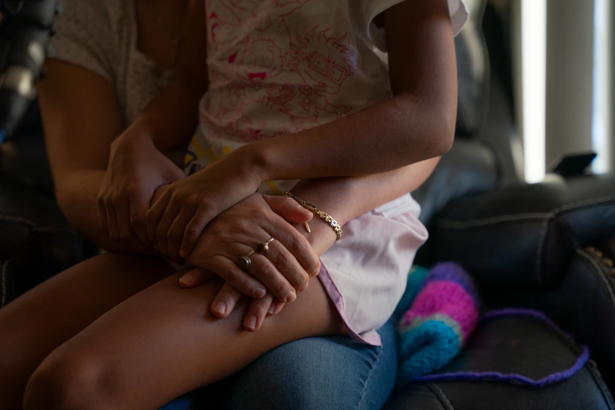 V and her 8-year-old daughter have not left their home in Minneapolis in more than a month because they don't feel safe going outside amid the heavy ICE surge in the city. V says she feels trapped in her own home.