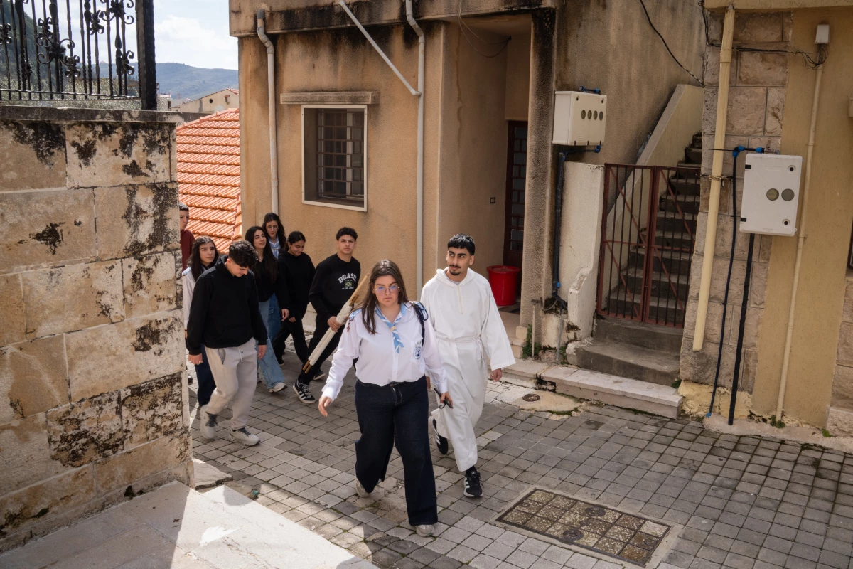 Youth from the Maronite church in Jezzine celebrate Lazarus Saturday, the day before Palm Sunday, by going from house to house and performing the story of Lazarus rising from the dead.