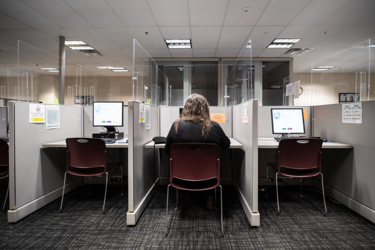 Mara spends time working at the computer at CareerForce, a resource for job seekers in Minnesota, on March 4.
