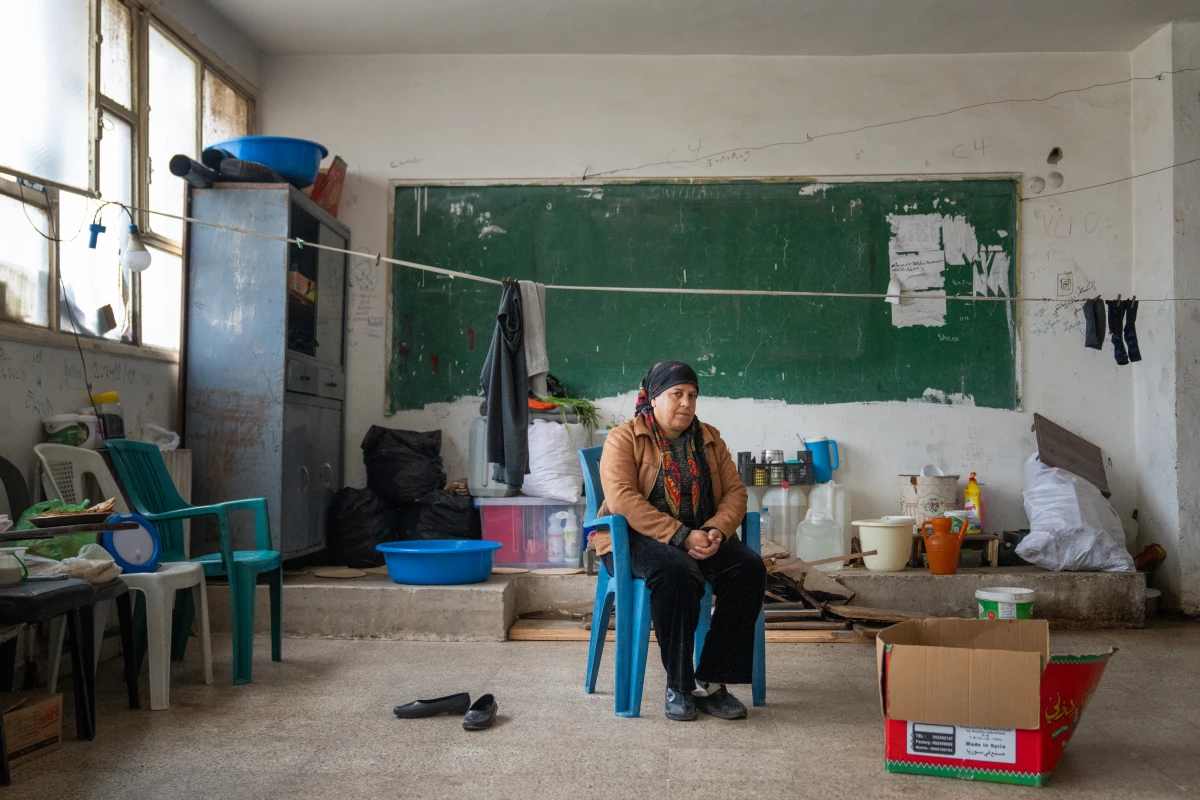 Gulestan Rashid helps run the shelter at the vacant school.