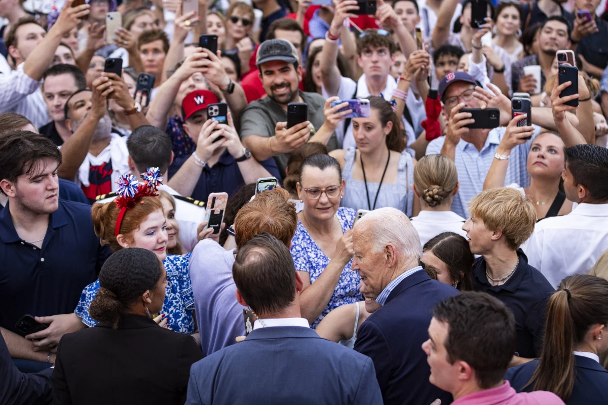 President Biden greets guests during a July 4th event on the South Lawn of the White House.