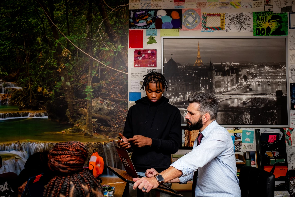 Walter and Kwakenat talk in the classroom.