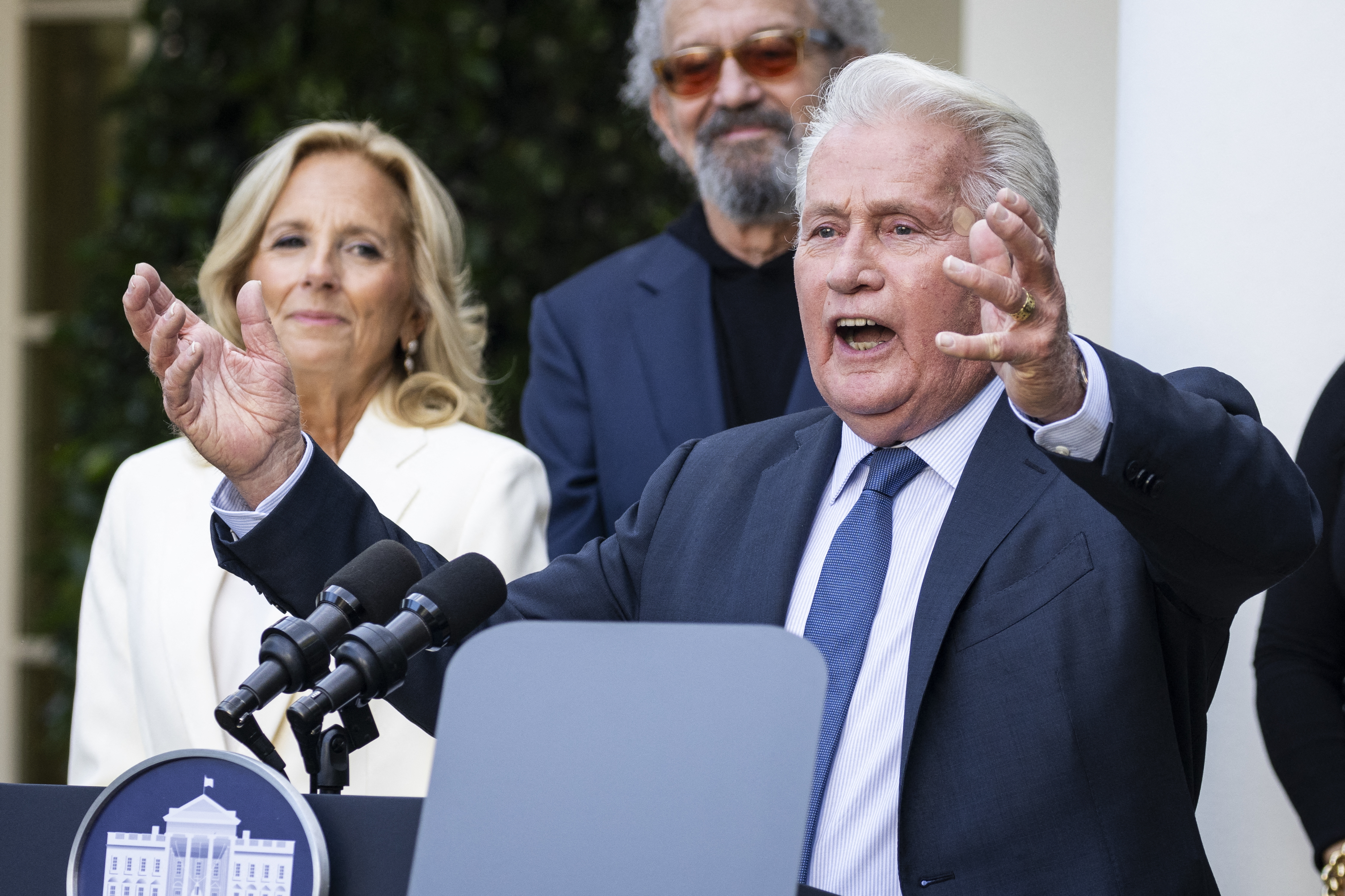 Actor Martin Sheen speaks alongside U.S. first lady Jill Biden and members of the cast during an event to mark the 25th anniversary of the television series <em>The West Wing</em> at the White House.
