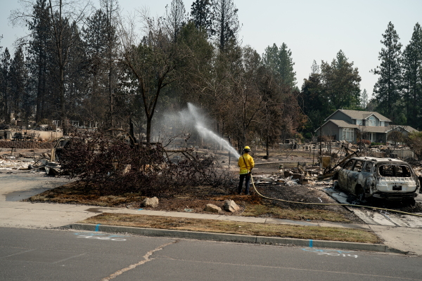 Firefighters visit burned homes to put out hot spots on the properties to prevent new blazes.
