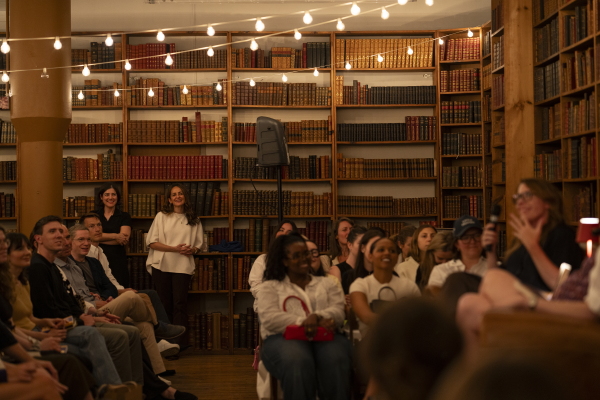 Erica Cerulo (left) and Claire Mazur, co-founders of 831 Stories, stand in the back while listening to Erika Veurink's author talk at the Strand Bookstore.