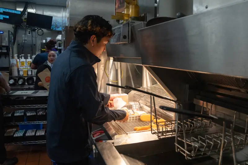 Jason Guevara, a kitchen manager, prepares hash browns.