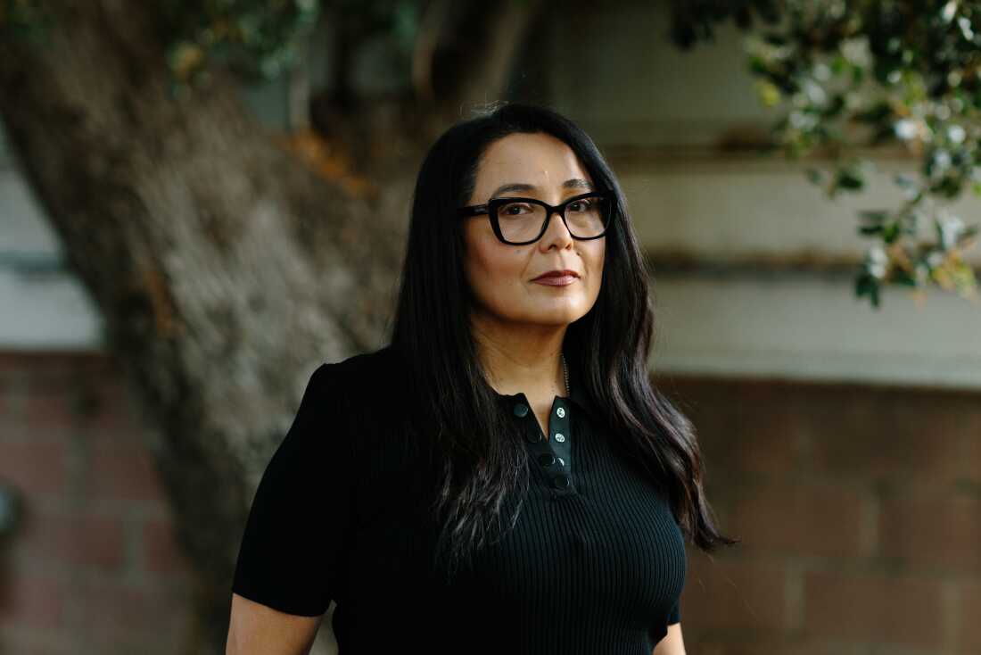 Yadira Dessaint, whose son is deployed to the Middle East, stands for a portrait outside her home in Southern California on May 6, 2026.