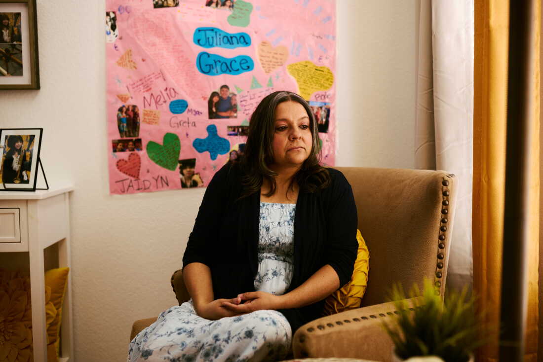 Cynthia Montoya sits in the living room of her home, where photographs and memories of her daughter, Juliana, surround her in Thornton, Colo.