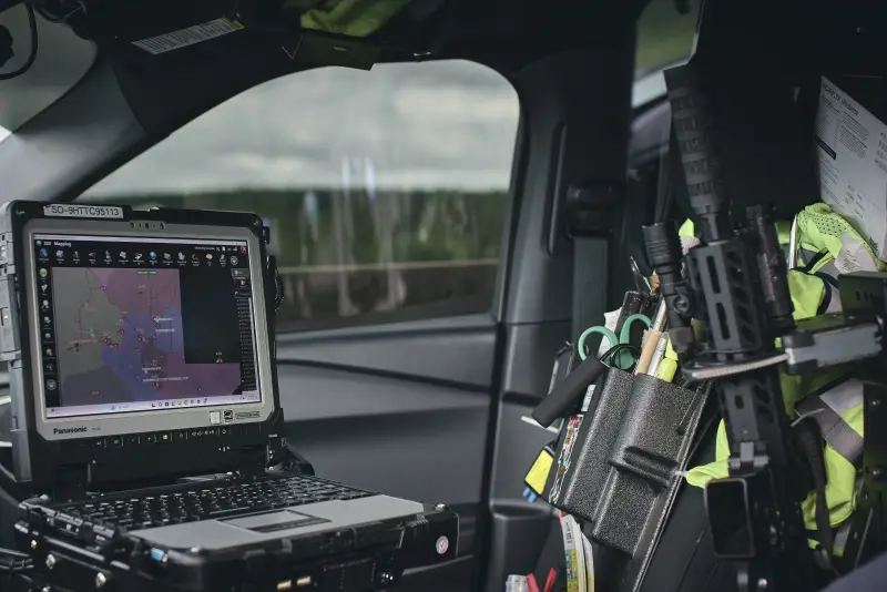This photo shows the interior of Sgt. Oscar D’Lassalas' SUV. In it, among other items, is a laptop computer with a map on its screen.