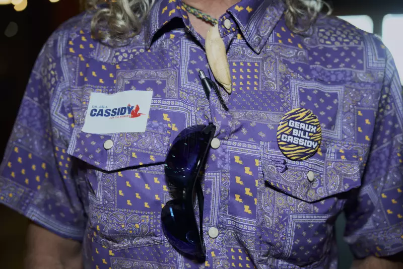 Jeff Aguillare, whose daughter works for Bill Cassidy, wears a "Geaux Cassidy sticker" at a campaign event on May 4, 2026 in Baton Rouge, La.