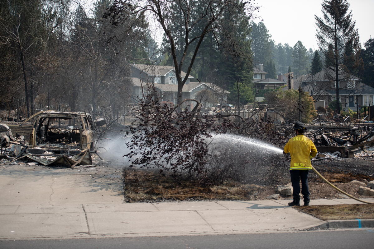 Spokane wildfire evacuees return home, but it's 'still a hazmat situation' 2 A firefighter puts out a hot spot to prevent new blazes on August 6, 2026 in Spokane, Wash.