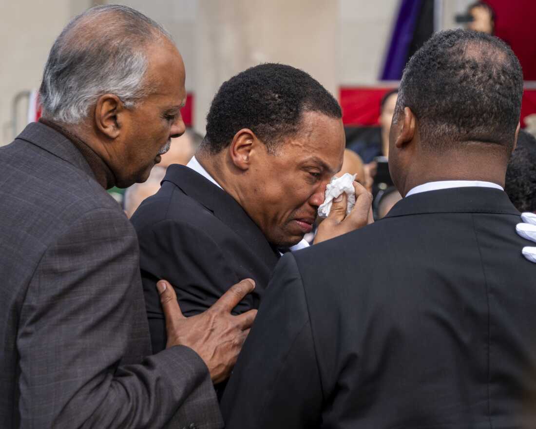Yusef Jackson is comforted by family members following the homegoing service for the Rev. Jesse Jackson in Chicago on Saturday.
