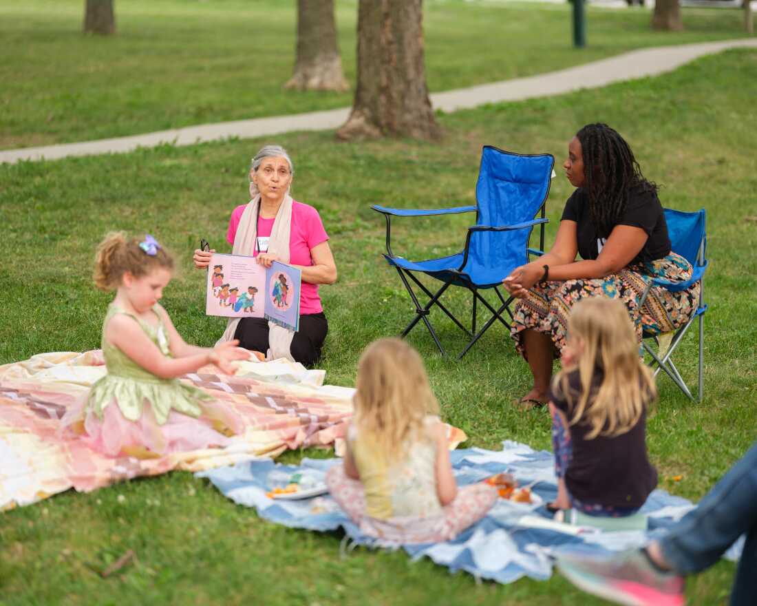 Storyteller Claudia Rains reads to families during Prime Time Family Reading at Henry Park in Lincoln, Neb. on May 14, 2026. Prime Time is a program that helps children hone their reading and critical thinking skills and is supported by Nebraska’s endowment fund.