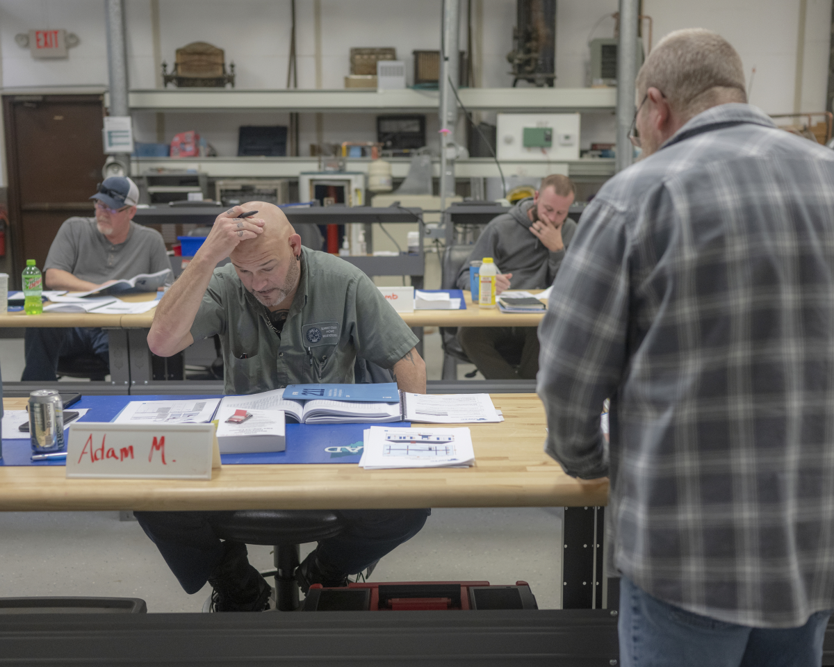 Adam Murdock (left) attends attends a training class for weatherization inspectors at the Corporation for Ohio Appalachian Development.