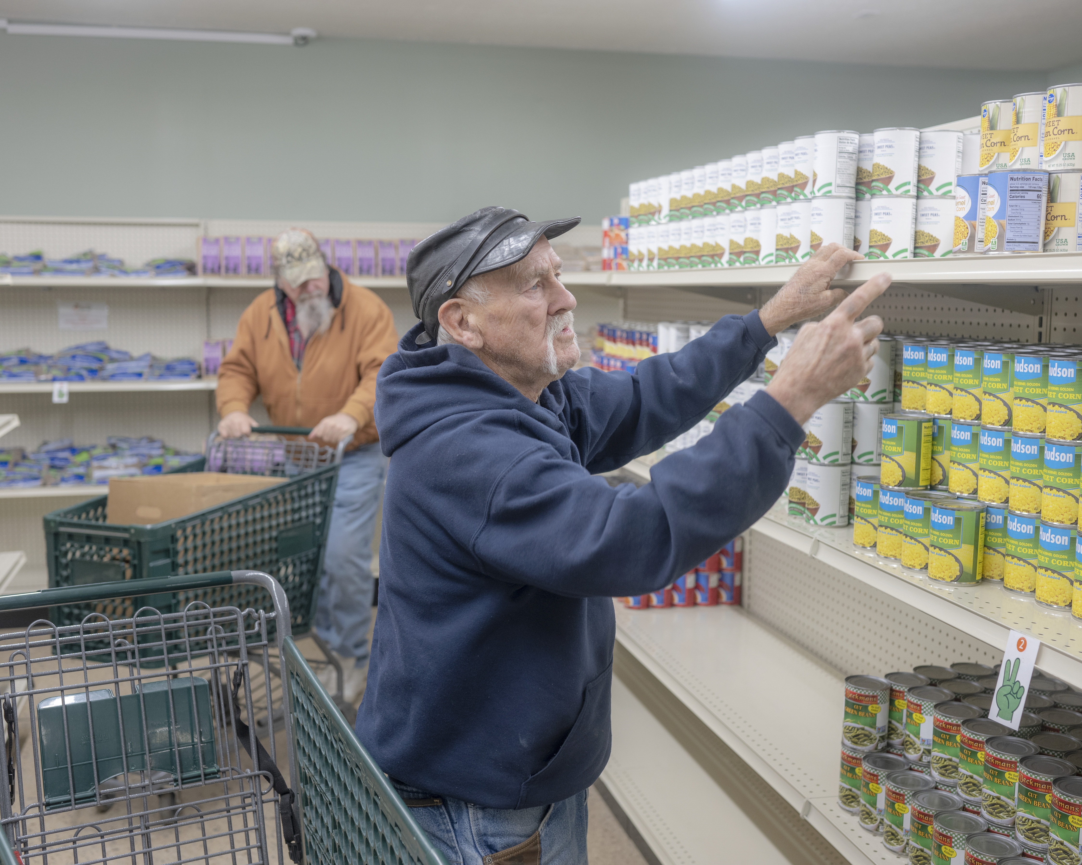 Paul B. Miller shops at The Market food pantry in Logan, Ohio on Dec. 9. Food aid was just one of many services offered here that faced disruption in 2025.
