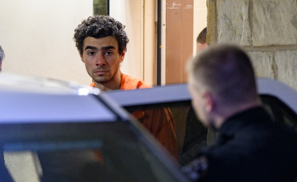 Suspected shooter Luigi Mangione is led from the Blair County Courthouse after an extradition hearing Dec. 10 in Hollidaysburg, Pennsylvania.