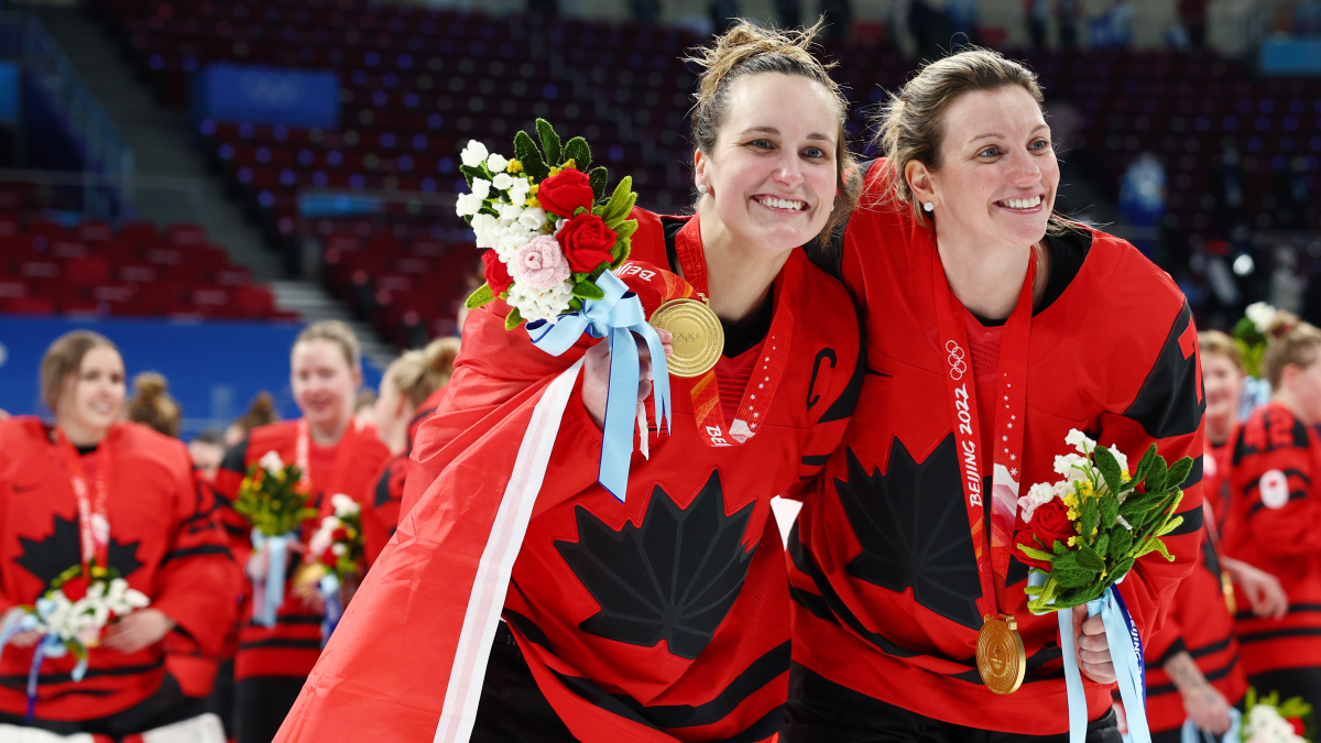 Marie-Philip Poulin, right, and Laura Stacey of Team Canada celebrate after winning the hockey gold medal match against Team United States.