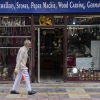 A Kashmiri man walks past a shop displaying stone jewellery and Kashmiri handicrafts in Srinagar, Indian controlled Kashmir.