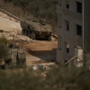 Israeli armored vehicles are seen parked outside a Palestinian building in the West Bank town of Turmus Ayya, Friday, Oct. 23, 2026. (AP Photo/Leo Correa)
